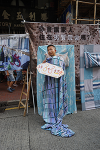 Participant in the annual pro-democracy march, Hennessy Road, Wanchai, 1 July 2018