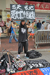 Participant in the annual pro-democracy march, Hennessy Road, Wanchai, 1 July 2018