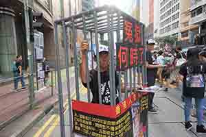 Participant in the annual pro-democracy march, Hennessy Road, Wanchai, 1 July 2018