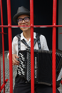 Artist Kacey Wong performing alongside the annual pro-democracy march from Victoria Park to the Central Government Offices Complex at Admiralty, 1 July 2018