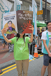 Participant in the annual pro-democracy march, Causeway Bay, 1 July 2018