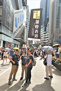 Participants in the annual pro-democracy march, Causeway Bay, 1 July 2018