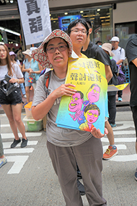 Participant in the annual pro-democracy march, Hennessy Road,  1 July 2018