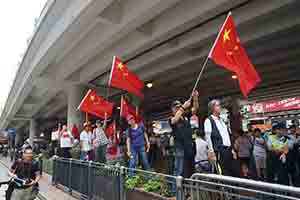 Counter-demonstrators against the annual pro-democracy march, Canal Road East, Wanchai, 1 July 2018