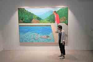 Art historian Monica Lee Steinberg with the painting Portrait of an Artist (Pool with Two Figures) by David Hockney, on display at H Queen's, Central, 29 September 2018