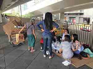 The use and reuse of cardboard boxes: scene on an overhead walkway in Sheung Wan, 14 October 2018