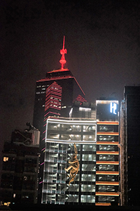 Monkey climbing a building's facade, Central, 20 December 2018