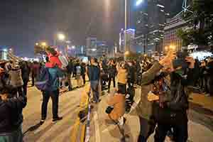 People taking photos during a firework display, Lung Wo Road, Central, 1 January 2019