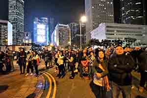 People watching a fireworks display for the start of the New Year, Lung Wo Road, Central, 1 January 2019