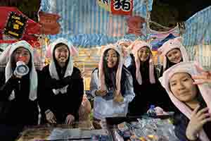 Selling pig-themed items at the Lunar New Year market, Victoria Park, Causeway Bay, 30 January 2019