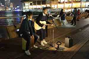 Busking after midnight at the Central Ferry Piers, 1 January 2019