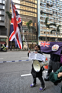 Protester with Union flag, calling for the resumption of British sovereignty over Hong Kong, Hennessy Road, Wanchai, 1 January 2019