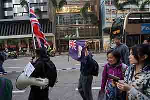 Protester with Union flag, calling for the resumption of British sovereignty over Hong Kong, Hennessy Road, Wanchai, 1 January 2019