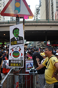 Posters on a sign pole, march from Causeway Bay to Central, Hennessy Road, Wanchai, 21 July 2019