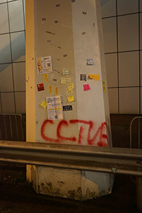 Graffiti and stickers on a pillar, Wanchai, 21 July 2019