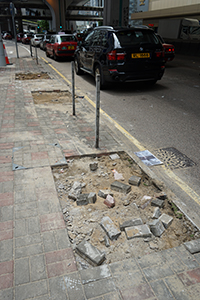 Pried up paving bricks and missing railings - the aftermath of protest in Sheung Wan,  22 July 2019