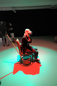 Person viewing the virtual reality film 'Kowloon Forest', Osage Gallery, Hing Yip Street, Kwun Tong, 5 July 2019