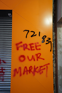 Graffiti on a closed shop, Hennessy Road, Wanchai, 15 September 2019