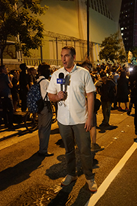 Journalist reporting outside Queen Elizabeth Stadium, Oi Kwan Road, Wanchai, 26 September 2019