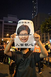 Protester with sign, outside Queen Elizabeth Stadium, Wanchai, 26 September 2019