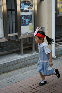 Coming home from school wearing a mask, Kwai Shing West Estate, 18 October 2019