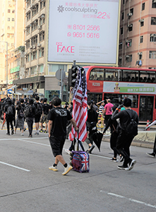 Protester with an American flag, Canton Road, Kowloon, 20 October 2019