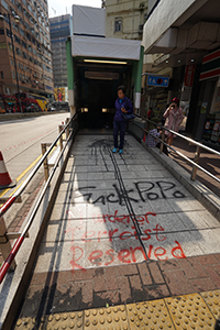Graffiti on an entrance to Jordan MTR station, Jordan Road, Kowloon, 21 October 2019