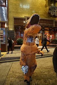 Person in a dinosaur costume, Wellington Street, Central, 31 October 2019