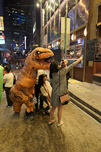 Taking a selfie with a dinosaur, Wellington Street, Central, 31 October 2019