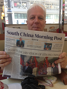 John Batten holding a copy of the SCMP, Des Voeux Road West, Sheung Wan, Hong Kong Island, 1 October 2019