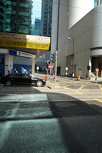 Light and shadow on a street, Des Voeux Road Central, Sheung Wan, Hong Kong Island, 11 November 2019