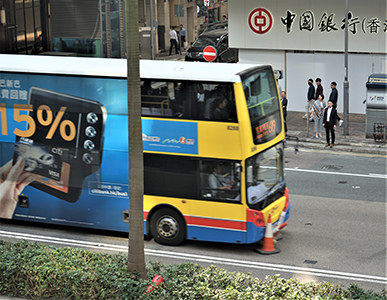 A Citybus vehicle driving through a road block, Connaught Road Central, 14 November 2019