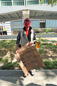 Protester at a climate change rally outside the Central Government Offices Complex, Tim Mei Avenue, 29 November 2019