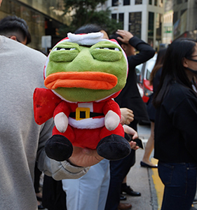 Protester with Pepe the Frog toy in Christmas costume, Pedder Street, Central, 29 November 2019