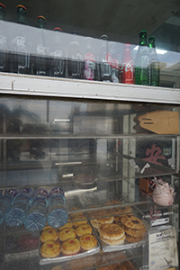 Window of the Hoi On cafe, with bakery items on display, Connaught Road West, Sheung Wan, 21 December 2019