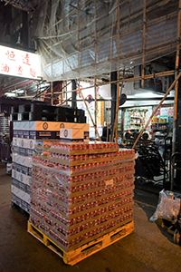 Stacks of Coca Cola and beer cans in the street, Canton Road, Kowloon, 26 December 2019