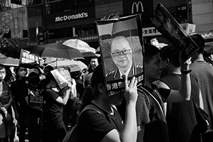 Protester with a sign, march from Causeway Bay to Central, 21 July 2019