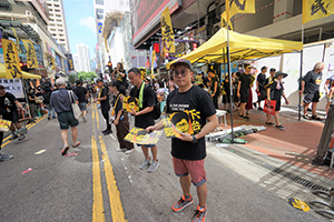 Civic Passion handing out posters, 1st July annual protest rally and march, Causeway Bay, 1 July 2019