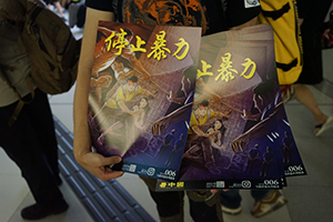 Handing out posters on the Yuen Long MTR station concourse, 'Reclaim Yuen Long' protest against the mob attack on 21 July, 27 July 2019
