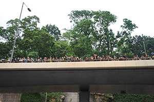 Protesters on a overhead driveway, anti-extradition bill march from Tsim Sha Tsui to West Kowloon Station, 7 July 2019