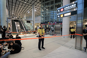 Staff inside West Kowloon Station, 7 July 2019