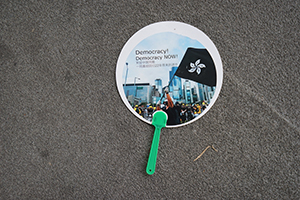 Paper fan on the ground, 'Reclaim Sheung Shui' protest against parallel traders from China, 13 July 2019