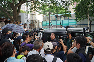 Police vehicle surrounded by protesters, 'Reclaim Sheung Shui' protest against parallel traders from China, 13 July 2019