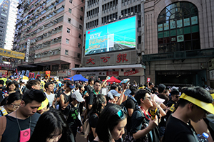 Crowds marching from Causeway Bay to Admiralty pass the offices of pro-CCP newspaper Ta Kung Pao, 1st July annual protest rally and march, Wanchai, 1 July 2019