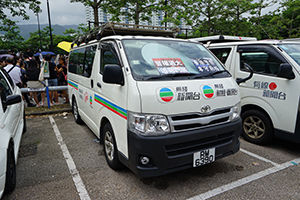 TVB vehicle with posters placed on its windshield by protesters, near the Che Kung Temple, Tai Wai, 14 July 2019