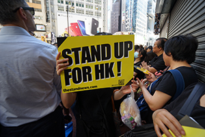 Protester with a sign, 1st July annual protest rally and march, Causeway Bay, 1 July 2019