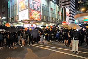 Protesters holding up umbrellas, Kimberley Road, Tsim Sha Tsui, 3 August 2019