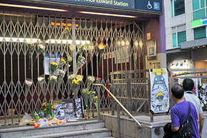 Flowers and posters outside a closed Prince Edward MTR Station entrance, 1 September 2019
