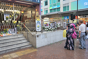 Flowers and posters outside a closed Prince Edward MTR Station entrance, 1 September 2019