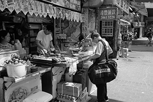 DHL worker buying street food, Lockhart Road, Wanchai, Hong Kong Island, 28 September 2019
